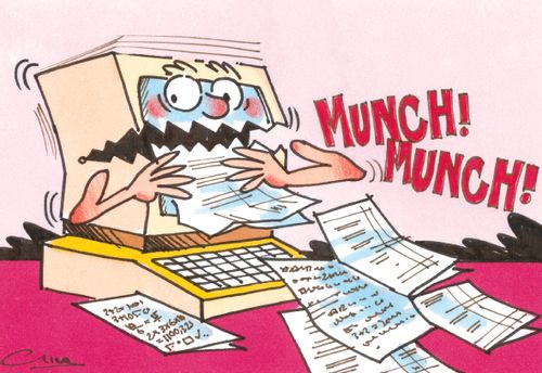 Computer munching his way through a pile of paper