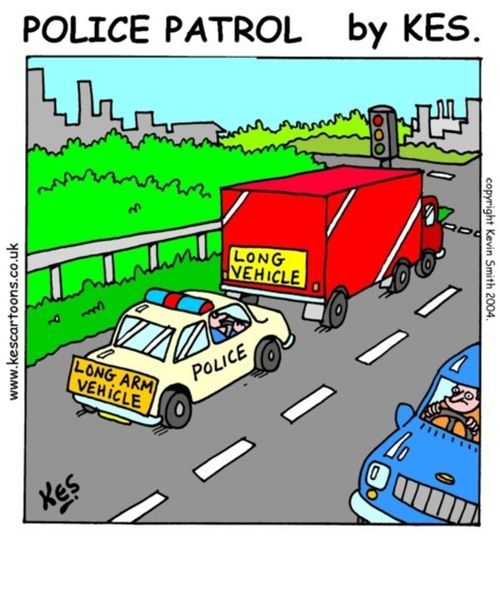 Police car sign reads: Long arm vehicle, as it follows a lorry with a sign reading: Long vehicle.