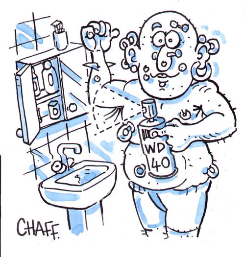 Man with body piercings using WD40 as deodorant.