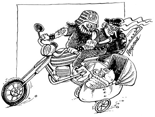 Biker couple with their baby in a side car.