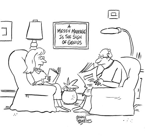 Couple with sign on wall: 'A Messy Marriage is the Sign of Genius'