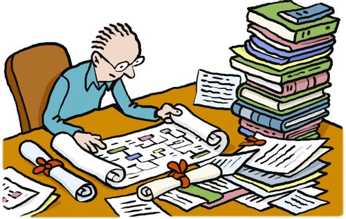 Man at desk researching through papers.