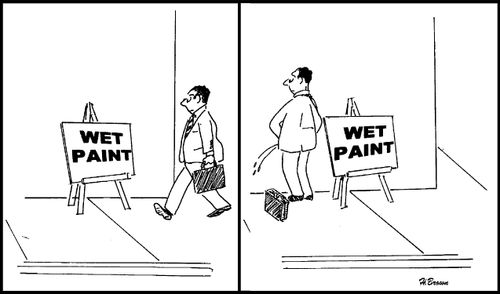 Man mistakes the meaning of a 'wet paint' sign.