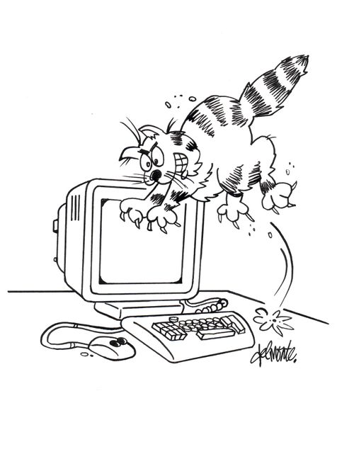 Cat sees a mouse attached to a computer on a table and jumps on it.