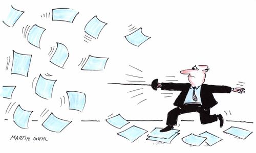 Man in office fencing with pieces of paper flying about