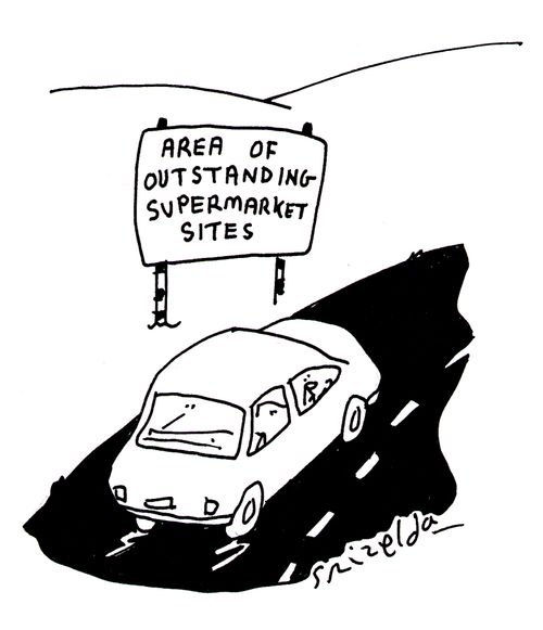 Sign at side of road reads - 'Area of outstanding supermarket sites.'