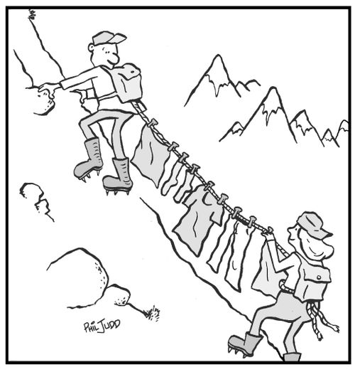 Mountain climbers with wet washing hanging on their safety rope to dry.