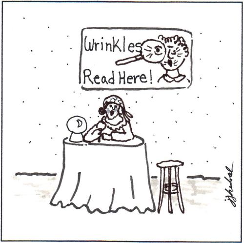 Fortune teller sits beneath a sign 'Wrinkles Read Here'