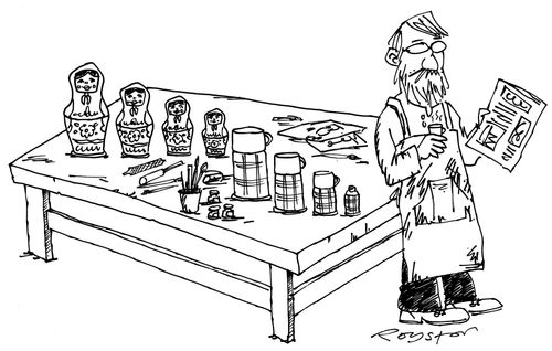 Russian doll maker takes a break. His flask of tea conceals smaller flasks, like Russian dolls.