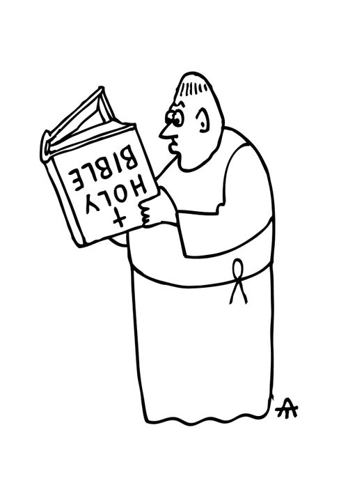 Monk reading an upside down bible.