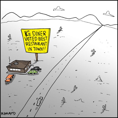 Sign reads: 'K's Diner Voted Best Restaurant in Town!!'
