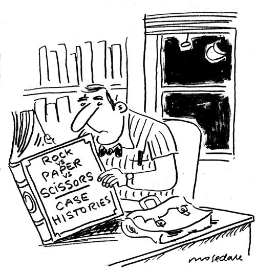 Lawyer studying 'Rock,Paper and Scissors' case histories.