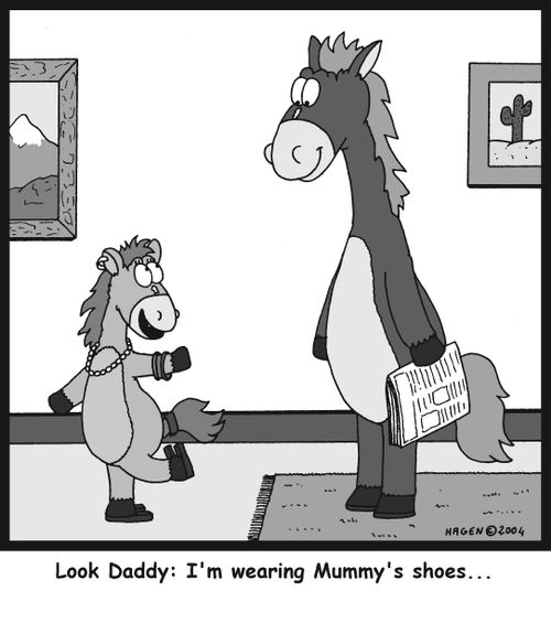 'Look Daddy: I'm wearing Mummy's shoes...'