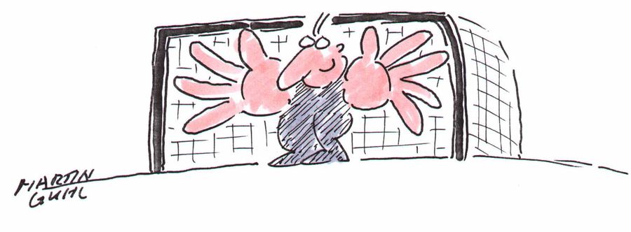 Man standing in goal with huge hands
