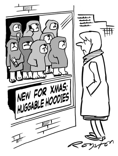 Woman looks at menacing cuddly toys in shop window. Sign says: 'New for Xmas: Huggable Hoodies.'