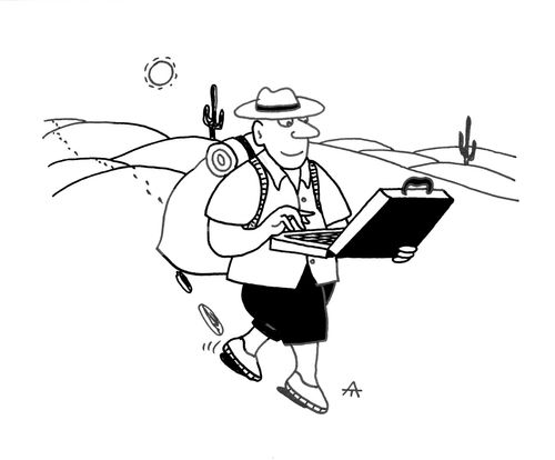 Tourist looks at his laptop rather than the scenery.