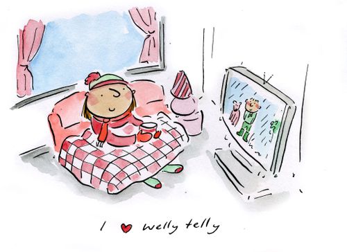 Woman watches TV wrapped up in warm clothing.