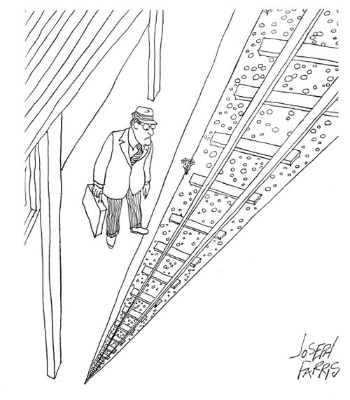 Man standing at a railway station.