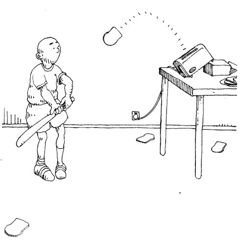 Boy with bat using toaster to launch bread for him to practise hitting