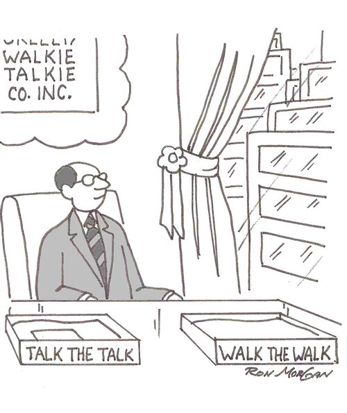 Walkie Talkie Company CEO has in/out boxes labeled: Talk the talk, Walk the Walk.