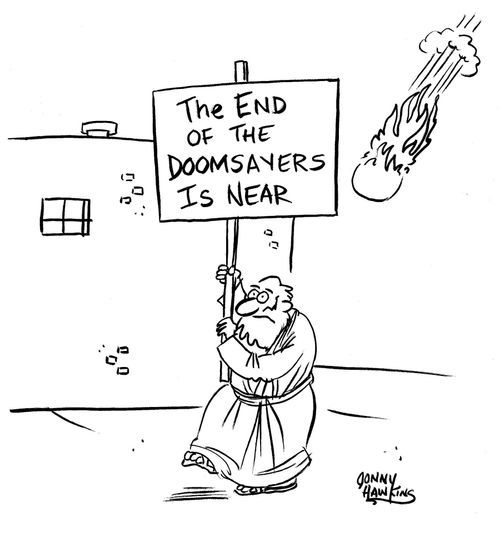 Doomsayer carries sign: 'The End of the Doomsayers is Near.'
