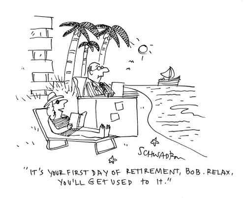 Retireee sits at desk on beach