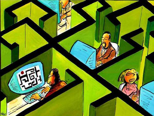 Man playing computer games in his office cubicle.