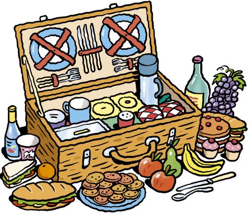 A picnic hamper surrounded by food.