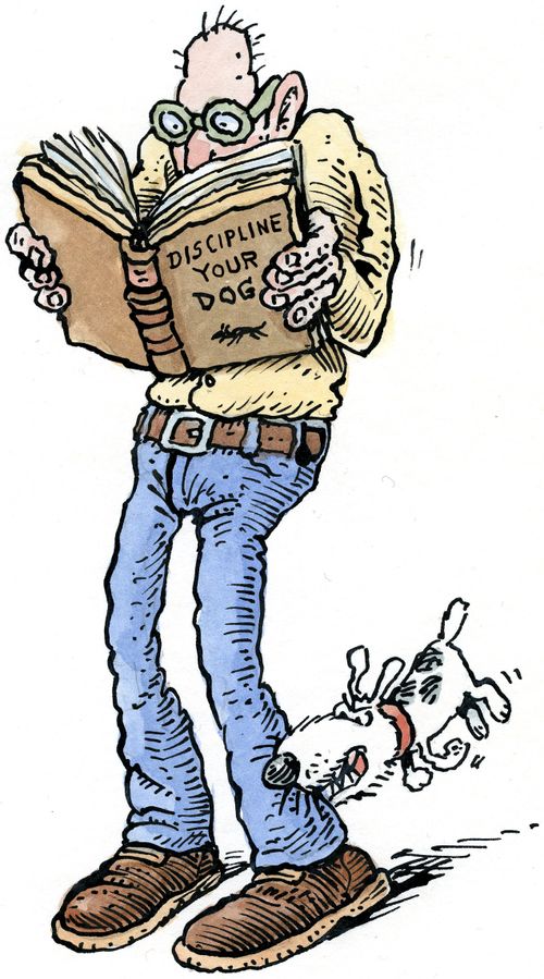 Man being bitten by dog as he reads a book on dog discipline