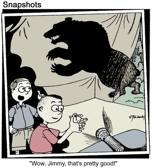 Boy makes a finger shadow on the tent.