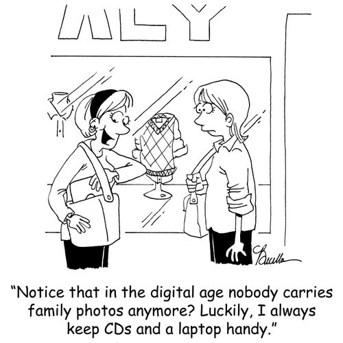 'Notice that in the digital age, nobody carries family photos anymore? Luckily, I always keep CDs and a laptop handy.'