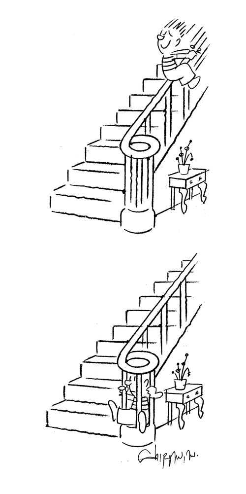 Boy slides down handrail.