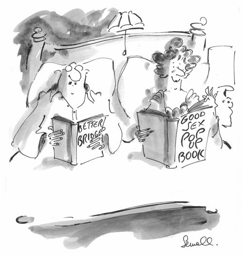Couple in bed reading guide-books