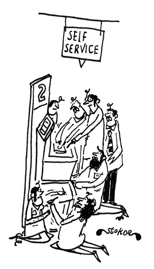 Lots of people helping out with the self-service machine.