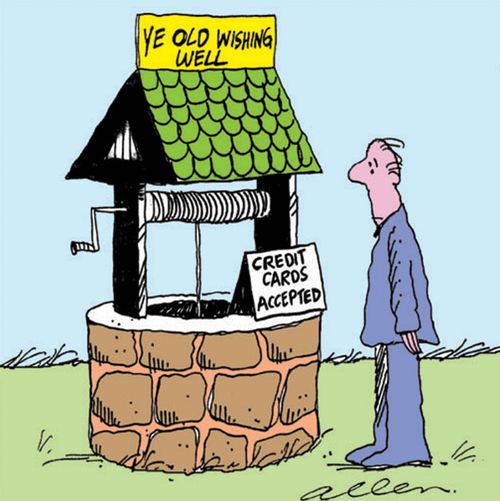 Wishing well with sign reading credit cards accepted.