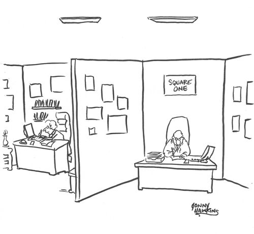 Man in cubicle has sign: 'Square One'.