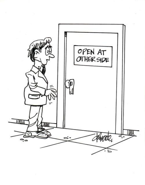 Man see a sign on door - Open At Other Side.