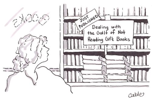 Woman looking at display sign in bookshop that reads 'Just Published. Dealing with the Guilt of Not Reading Gift Books.'