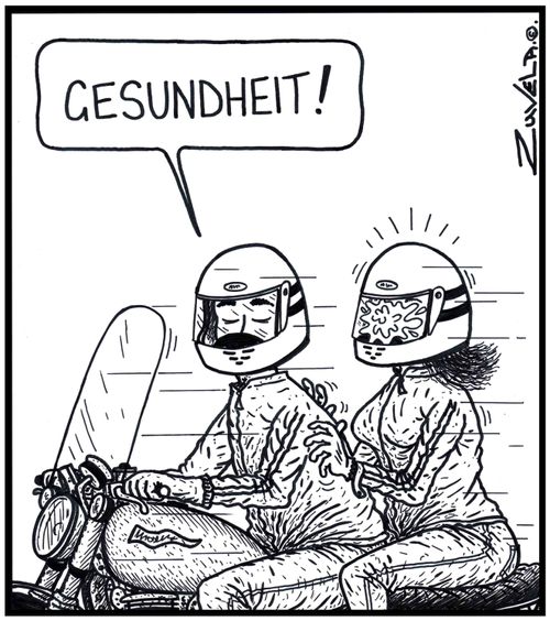 Biker: 'Gesundheit!' a female pillion passenger messes up the inside of her helmet from her sneeze