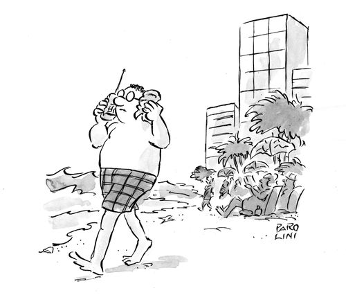 Man walking down the beach with a phone to one ear and a shell to the other.