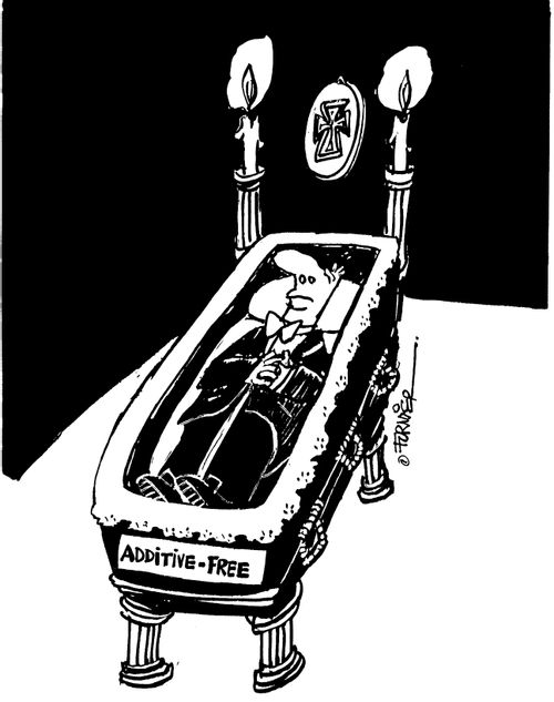 Mans funeral open casket a sign saying "additive free" at the bottom of the coffin