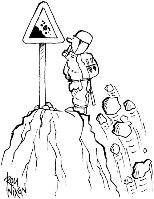 Falling rocks sign on mountain peak.