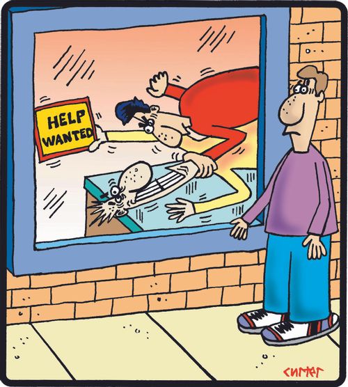 Man being beaten up holds a 'Help Wanted' sign.