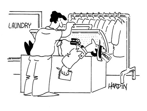 Journalist with a 'Press Pass' being put in a laundry press.
