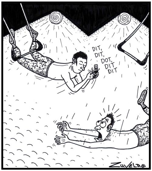 A trapeze artist texting forgets to grab his fellow artist.