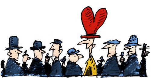 Man in crowd with heart shaped hat.