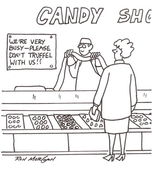 Candy shop has sign: We Are Very Busy. Please Do Not Truffle With Us.