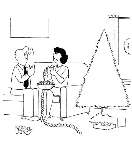 Husband eats popcorn wife is stringing for Christmas tree.