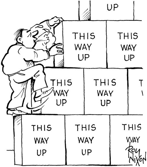 Climbing up stacked boxes marked this way up