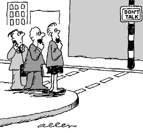 People on mobile phones, traffic lights read DON'T TALK.